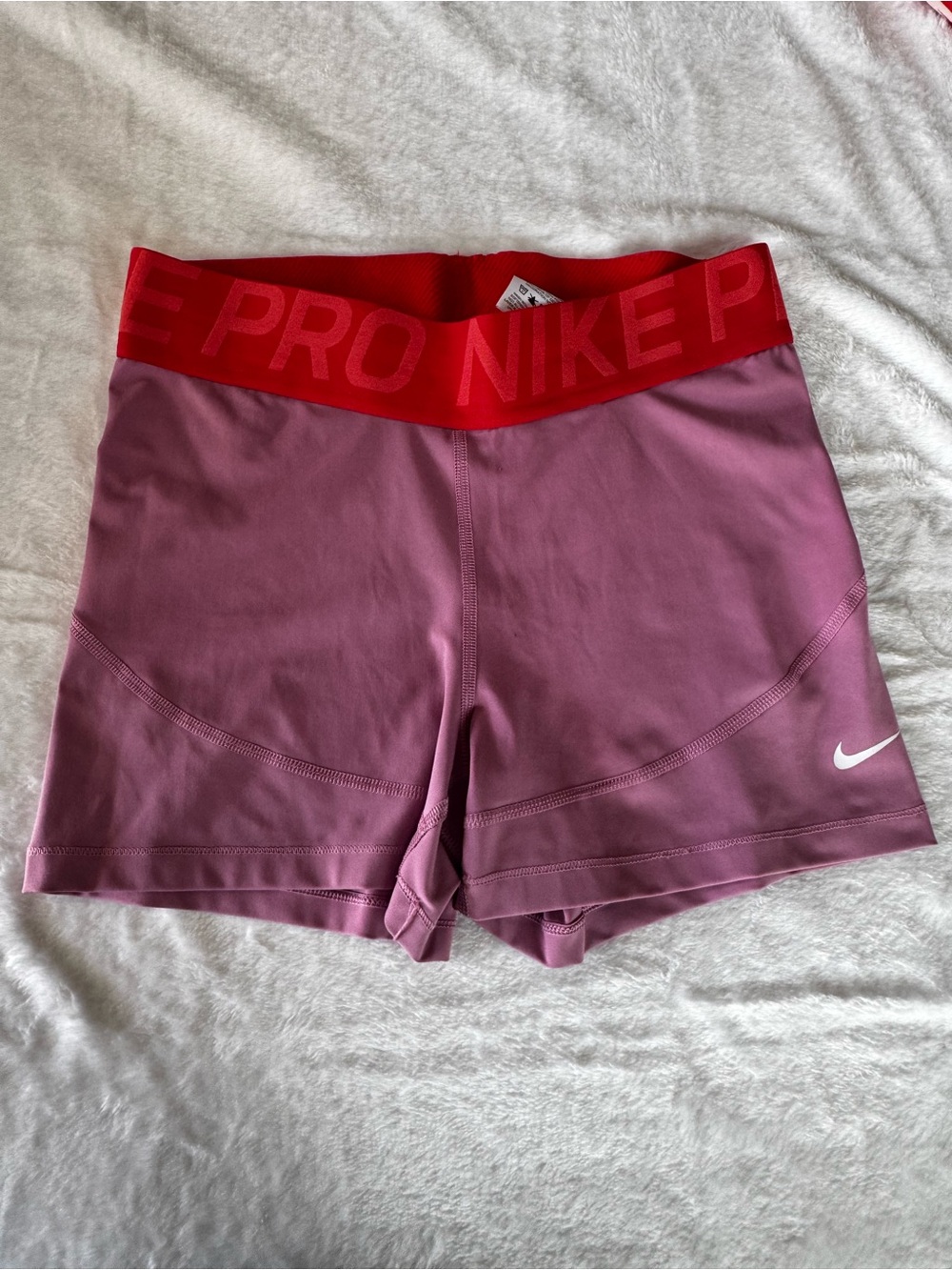 Nike Women's Pink Athletic Shorts with Red Elastic Waistband